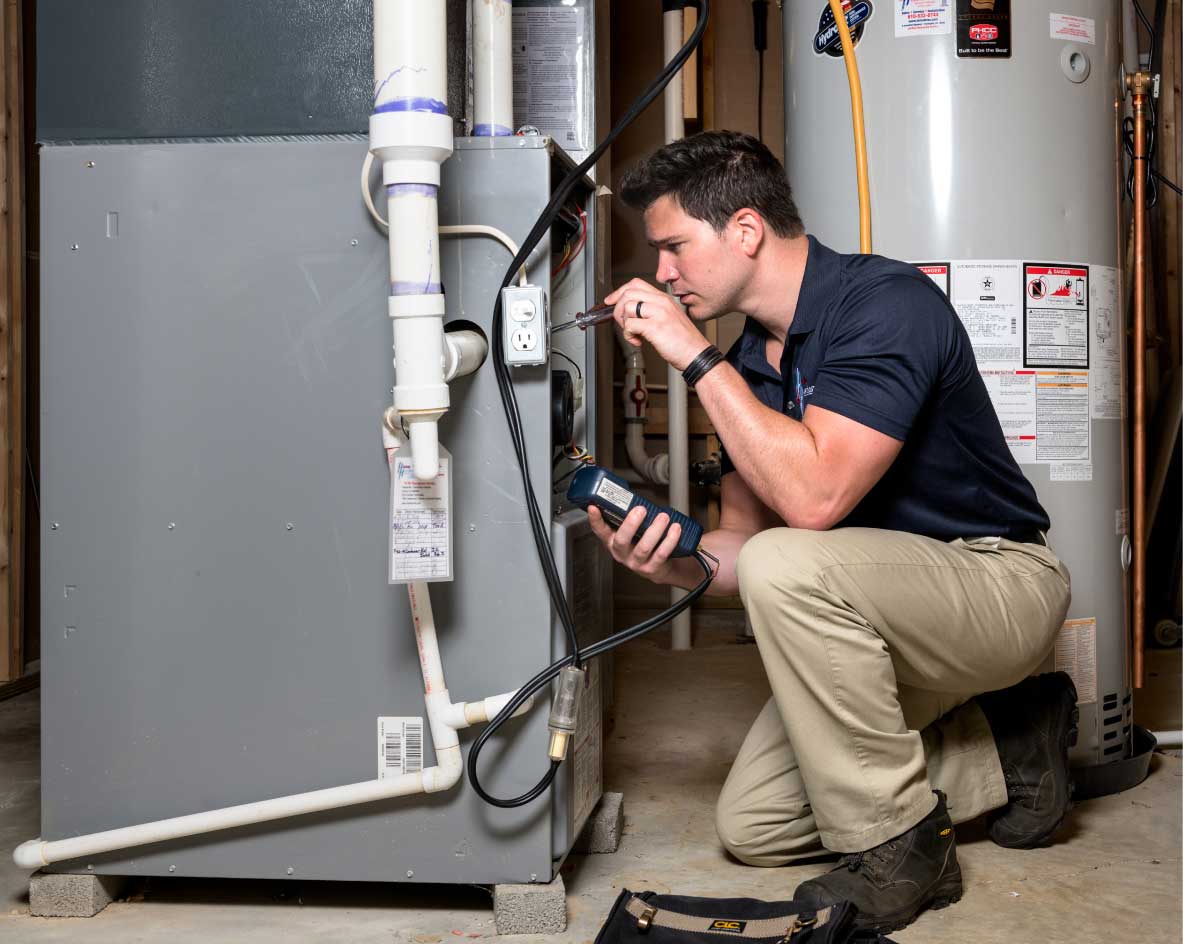 HVAC technician performing a furnace tune-up in Spanish Fork